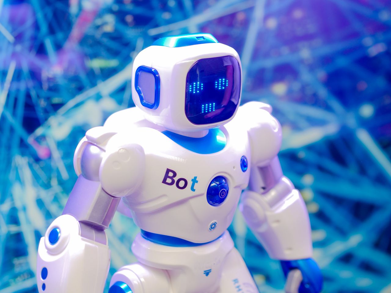 Home High-tech humanoid robot with LED face display, showcasing modern robotics and innovation.
